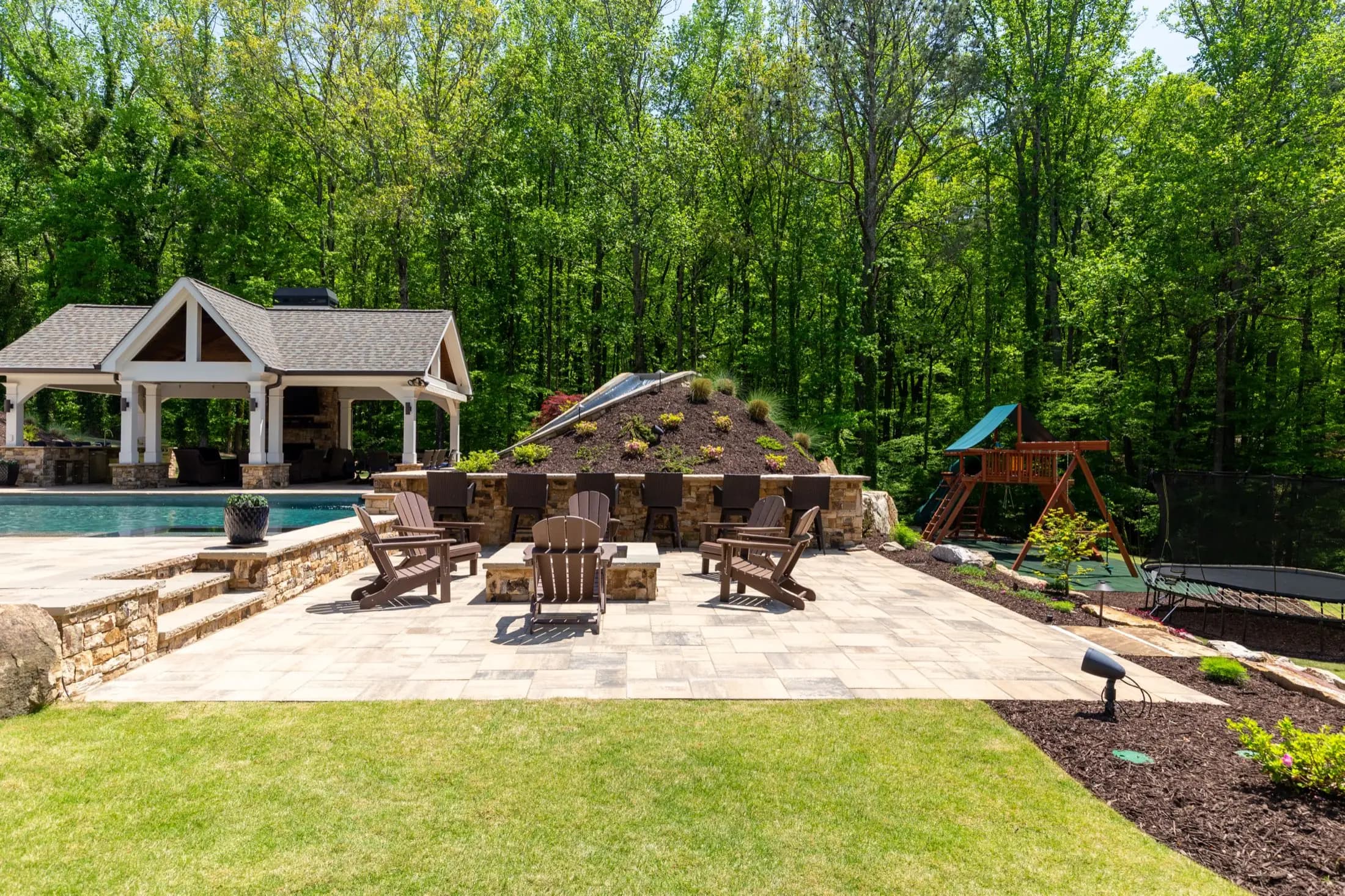 The fire lounge and pavilion at the Batchelor project in Roswell, part of the same connected backyard build as the pool