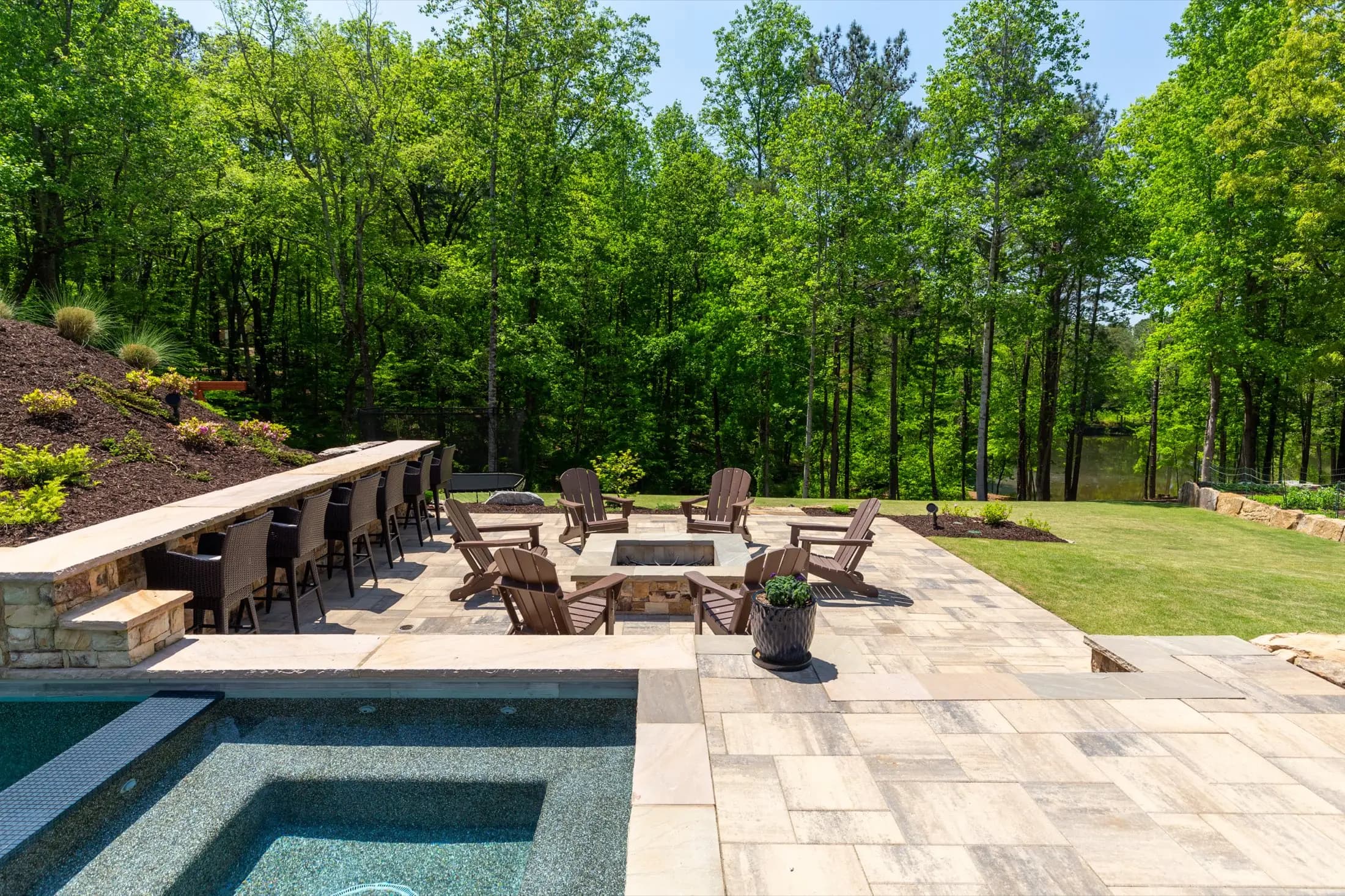 The spa and fire feature at the Batchelor project in Roswell, part of the outdoor living space built around the pool