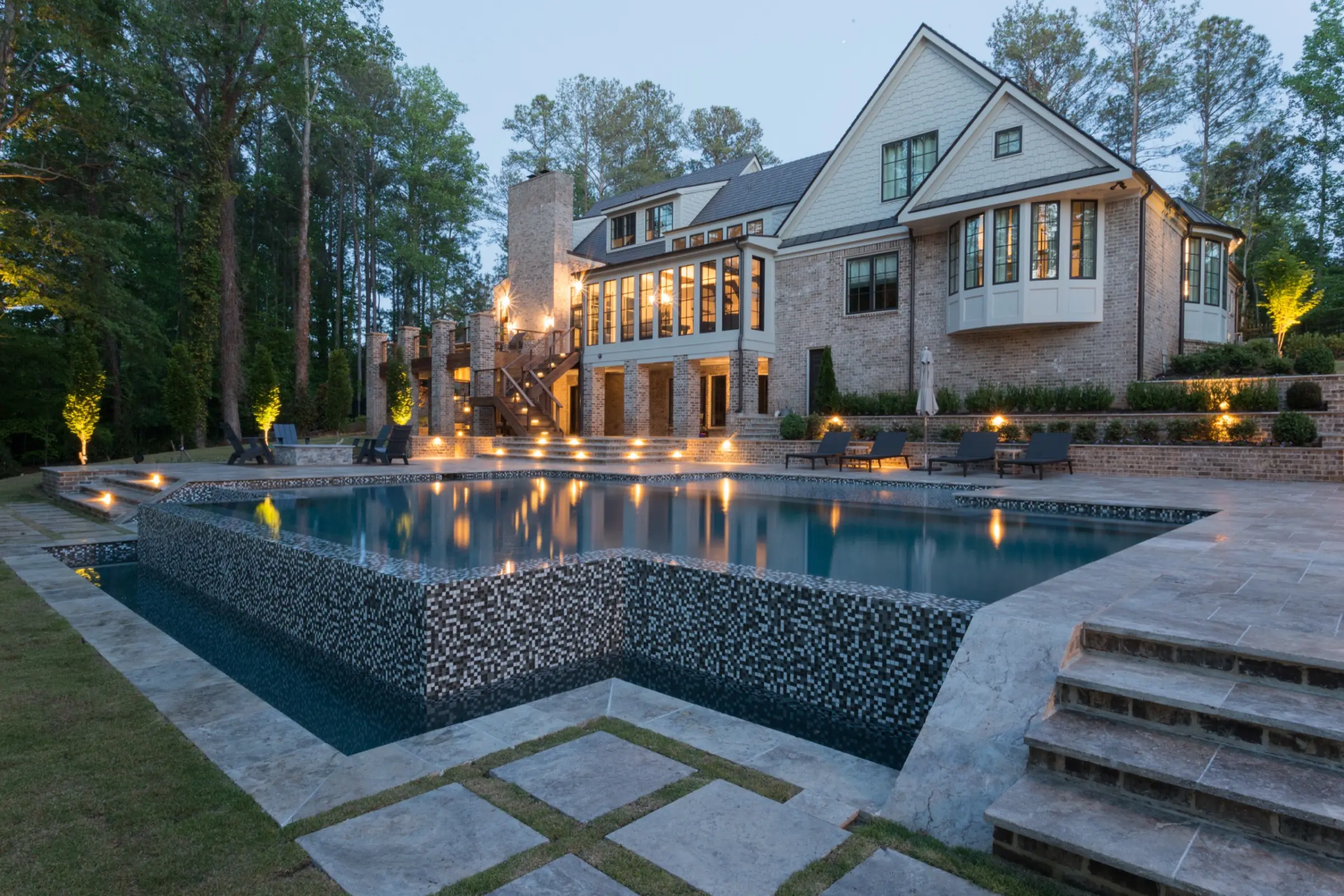 The finished Chadwell pool at twilight in Roswell after the full tear-out and rebuild