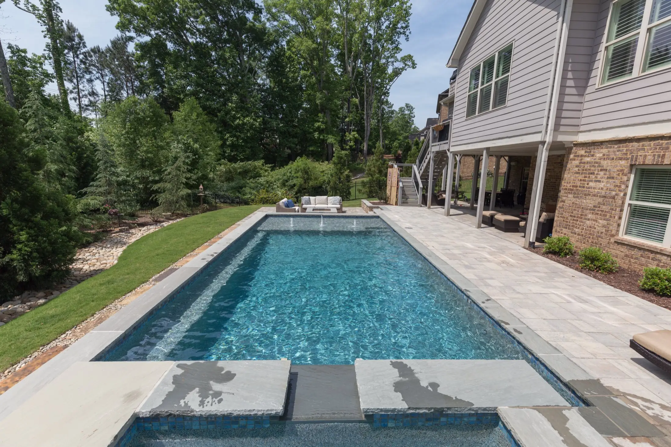 The Gaster pool in Marietta, the water stretching the length of the backyard