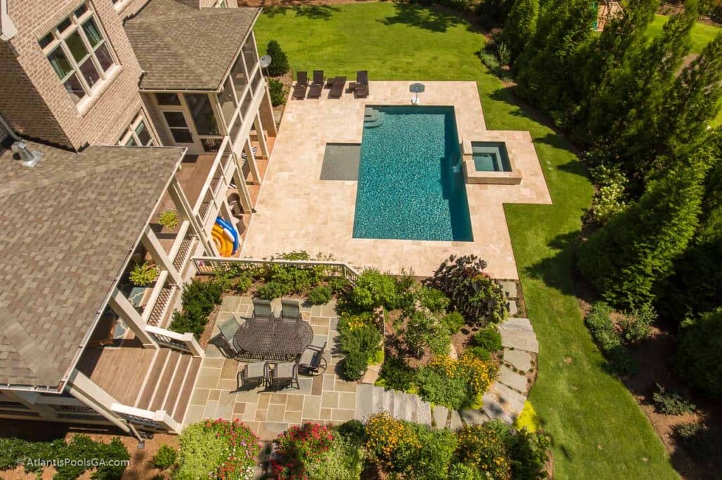 Aerial view of an Atlantis pool and its surrounding brick terrace